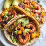 Spicy Shrimp Tacos with Mango Slaw and Avocado Crema